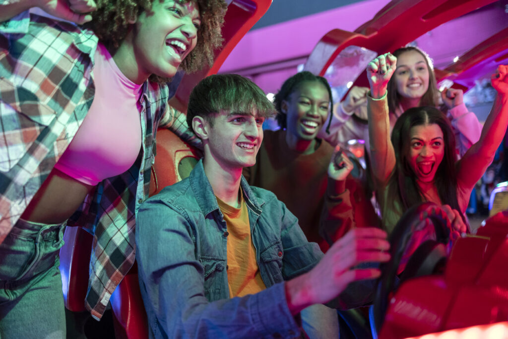 people playing arcade games